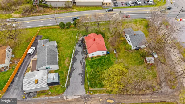 a view of a swimming pool with a yard