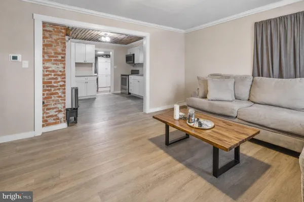a living room with furniture and a rug