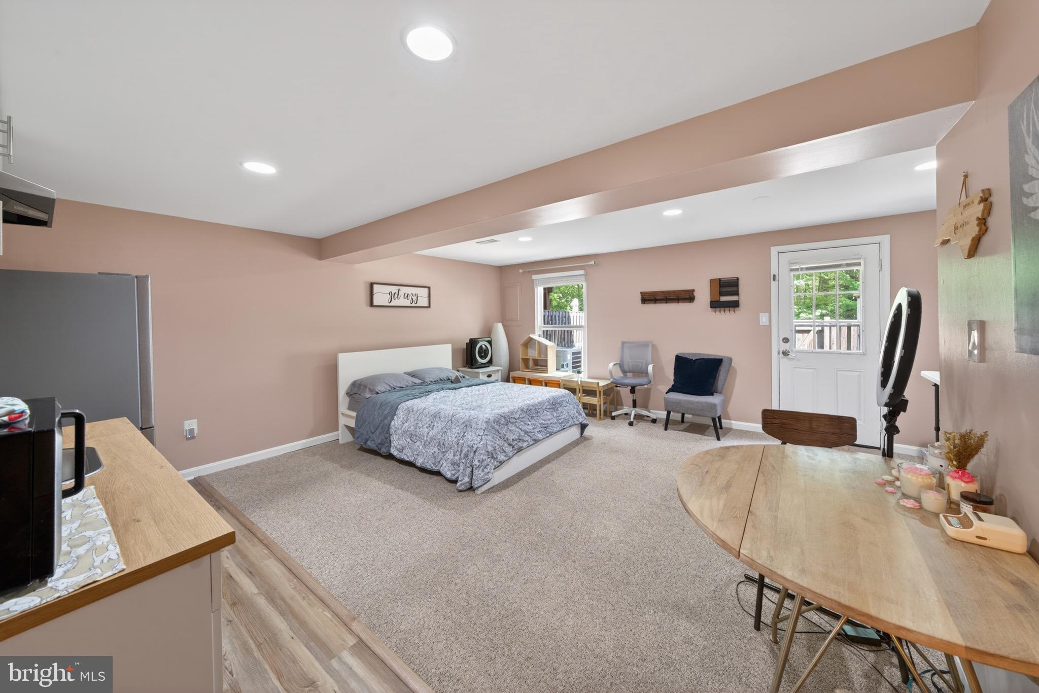 15095 Mill Spring Drive Dumfries, VA 22025 - Photo 22 of 36 a bedroom with furniture large window and flowerpot