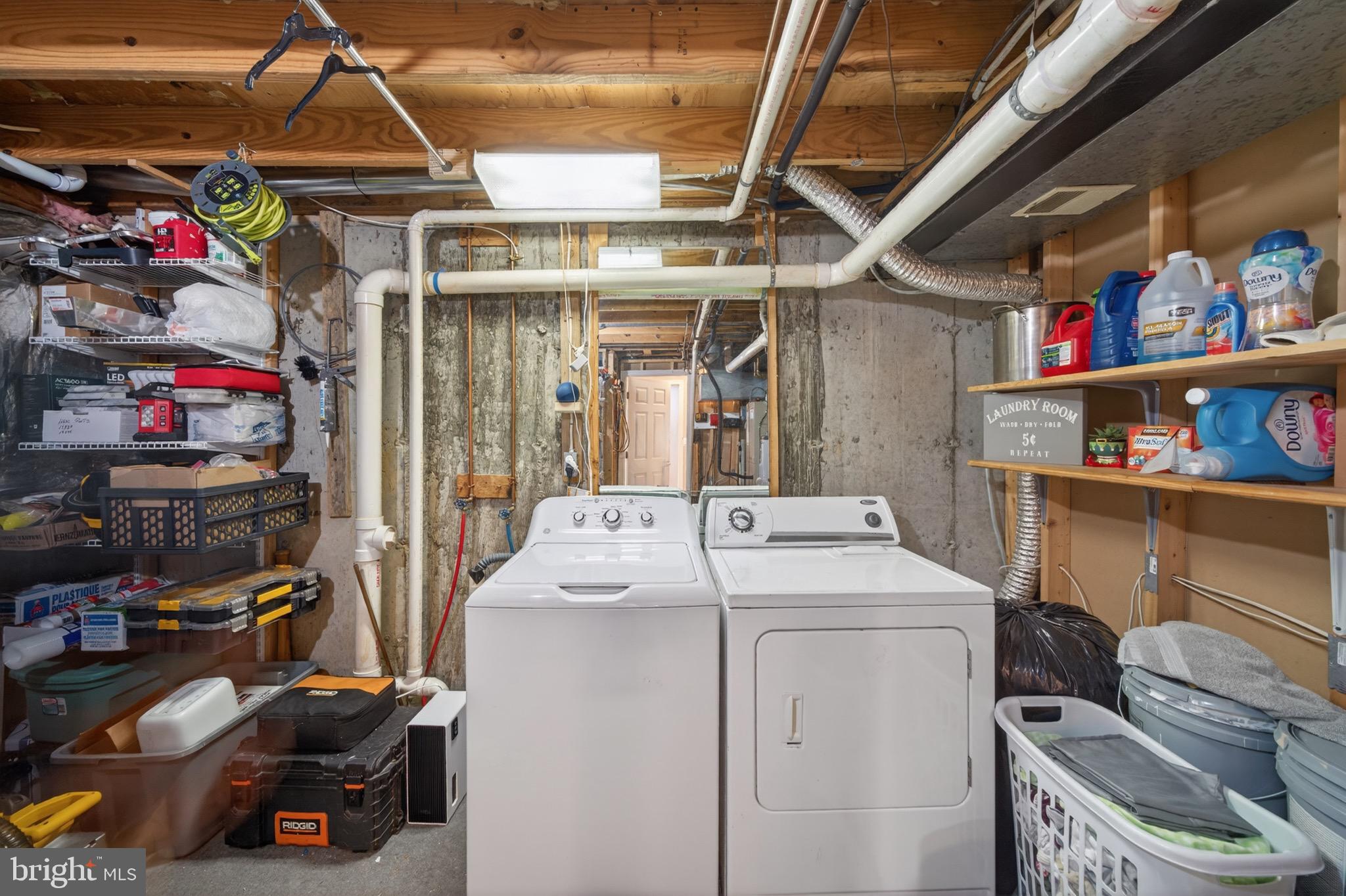 15095 Mill Spring Drive Dumfries, VA 22025 - Photo 23 of 36 a utility room with dryer washer and a wine table