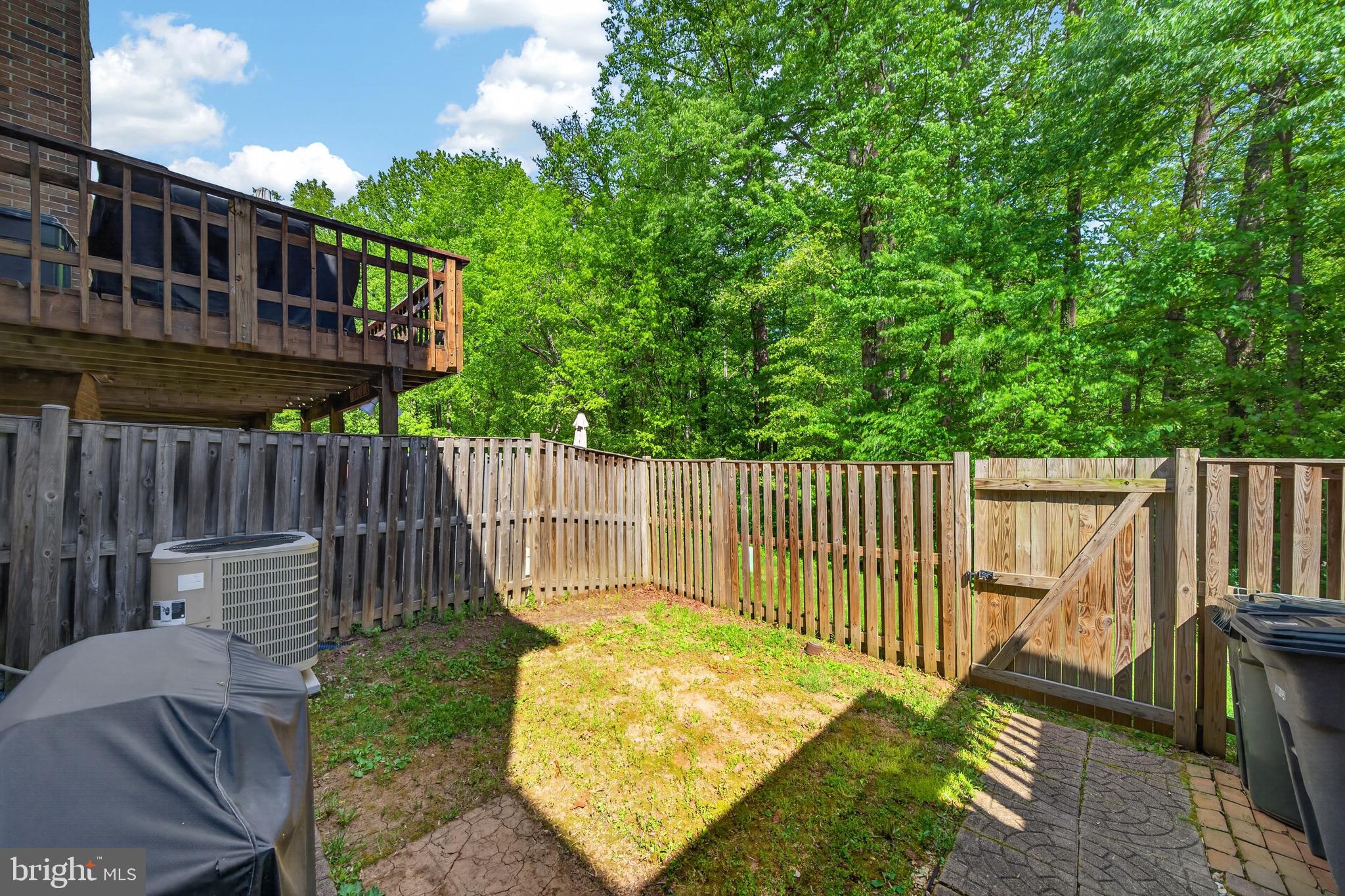 15095 Mill Spring Drive Dumfries, VA 22025 - Photo 26 of 36 a view of a wooden deck with furniture