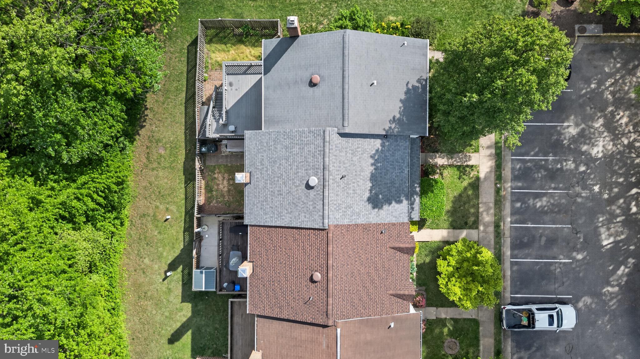15095 Mill Spring Drive Dumfries, VA 22025 - Photo 28 of 36 an aerial view of a house with a yard and large tree
