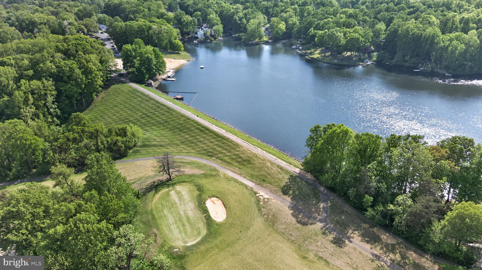 15095 Mill Spring Drive Dumfries, VA 22025 - Photo 35 of 36 a view of a lake with a yard