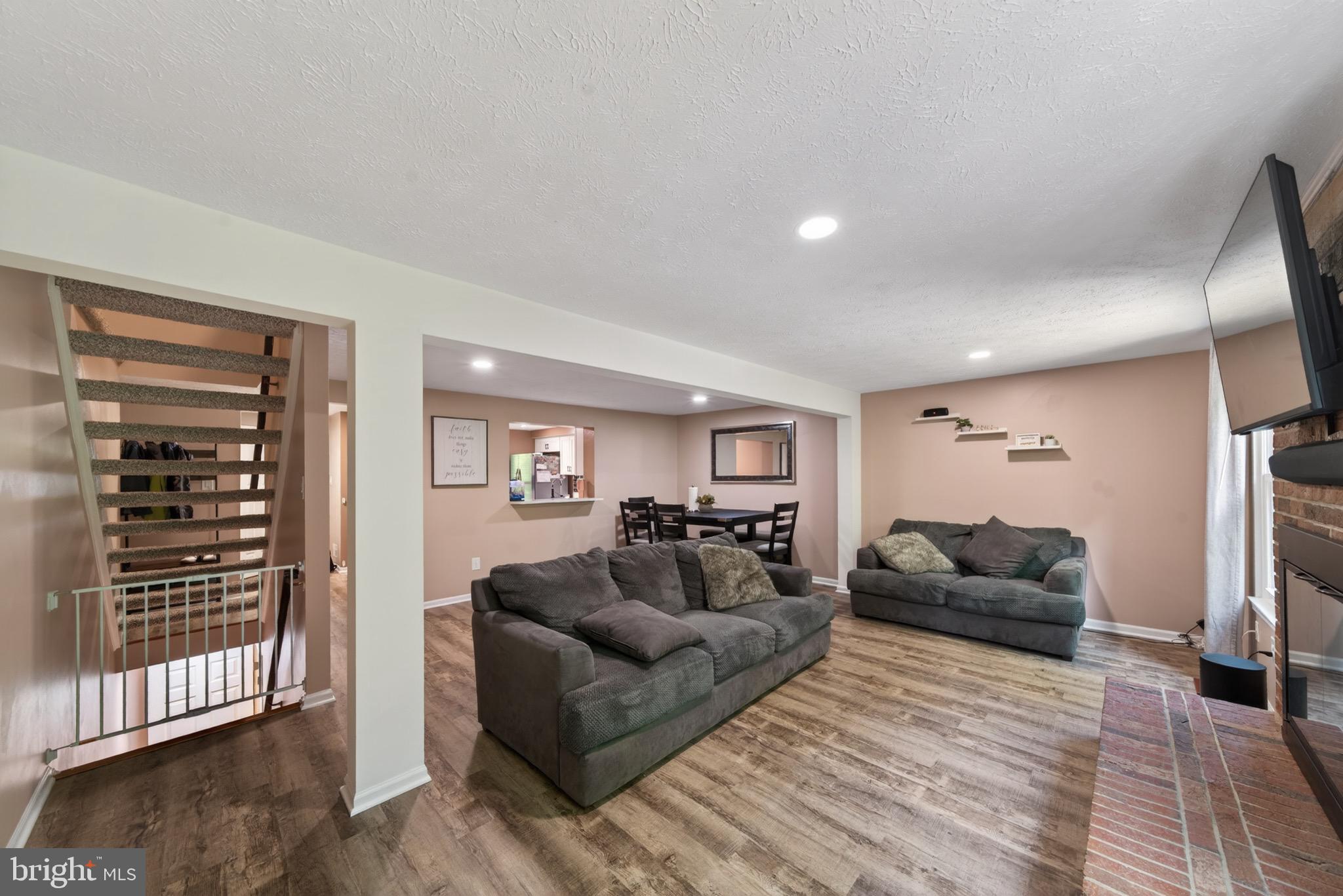 15095 Mill Spring Drive Dumfries, VA 22025 - Photo 10 of 36 a living room with furniture and a wooden floor