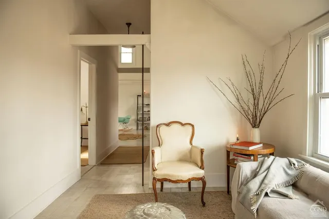 a view of a dining room with furniture and window