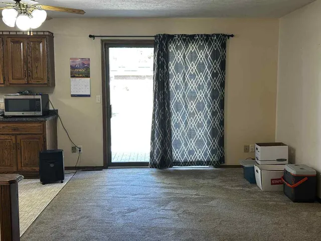 a view of livingroom with furniture and a window