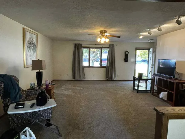 a room with furniture and a flat screen tv