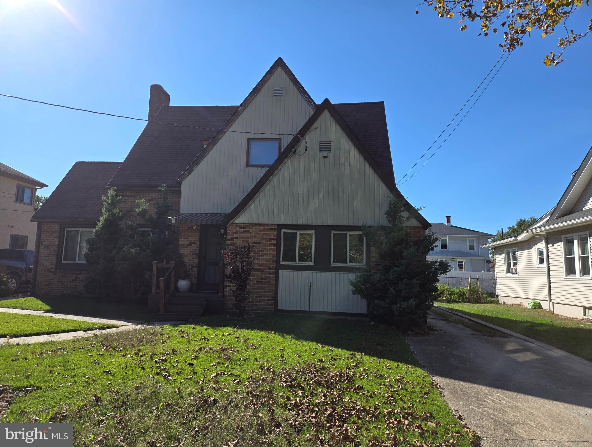 18 North State Street, Unit UPSTAIRS Vineland, NJ 08360 - Photo 1 of 5 a front view of a house with a yard