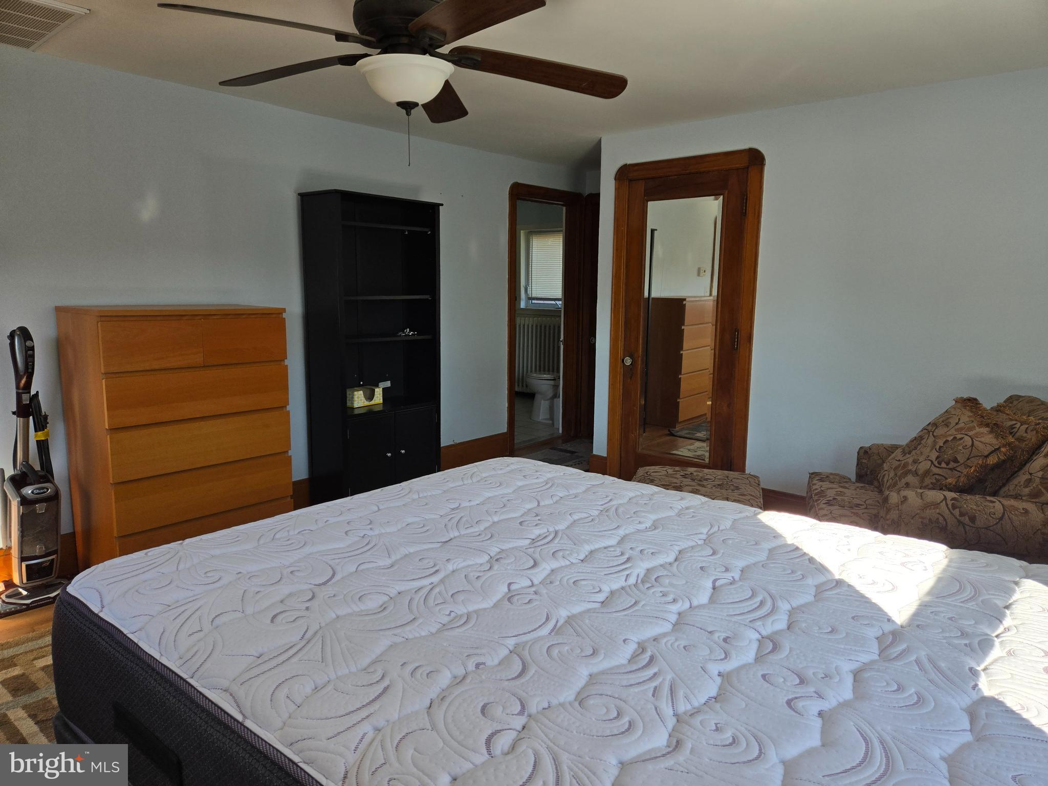 18 North State Street, Unit UPSTAIRS Vineland, NJ 08360 - Photo 3 of 5 a bedroom with a bed and a dresser