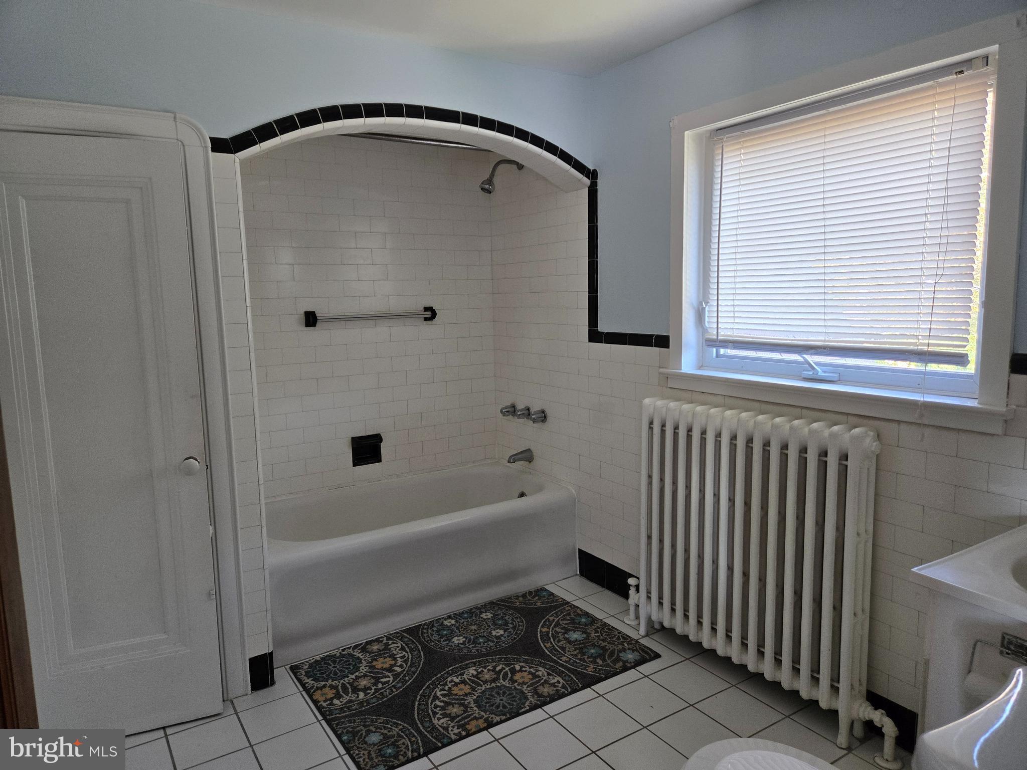 18 North State Street, Unit UPSTAIRS Vineland, NJ 08360 - Photo 4 of 5 a bathroom with a bathtub and a shower