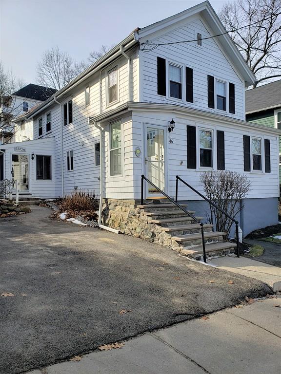 a front view of a house with yard