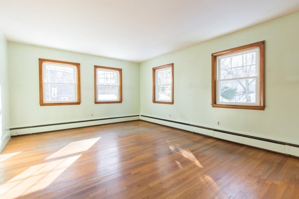 46 Eliot Crescent Brookline, MA 02467 - Photo 13 of 15 a view of a room with wooden floor and windows