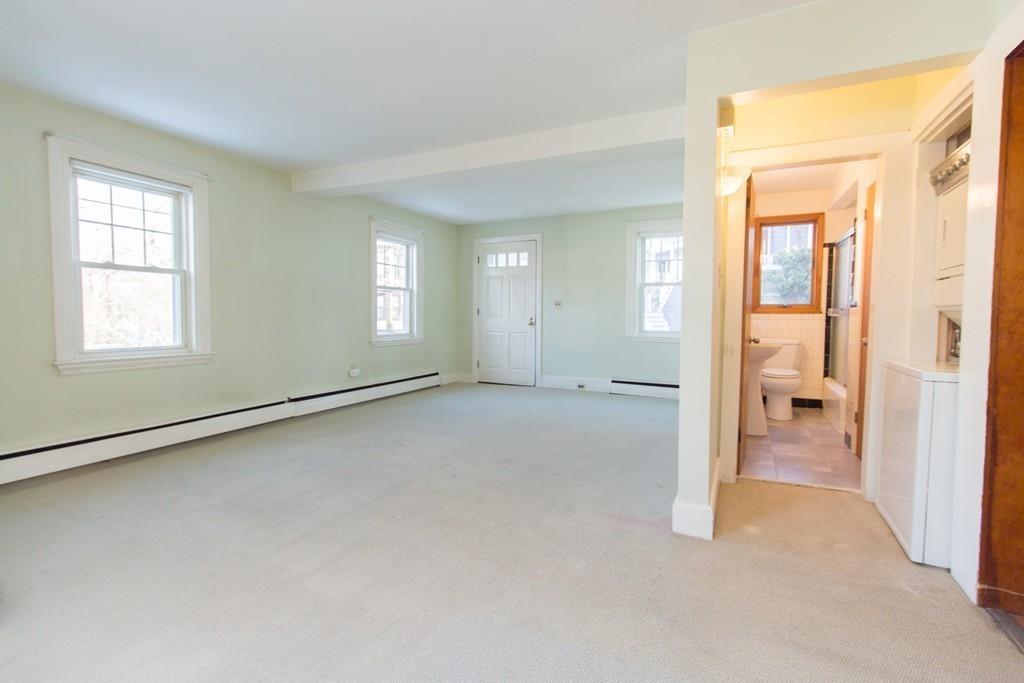 46 Eliot Crescent Brookline, MA 02467 - Photo 5 of 15 wooden floor and windows in an empty room