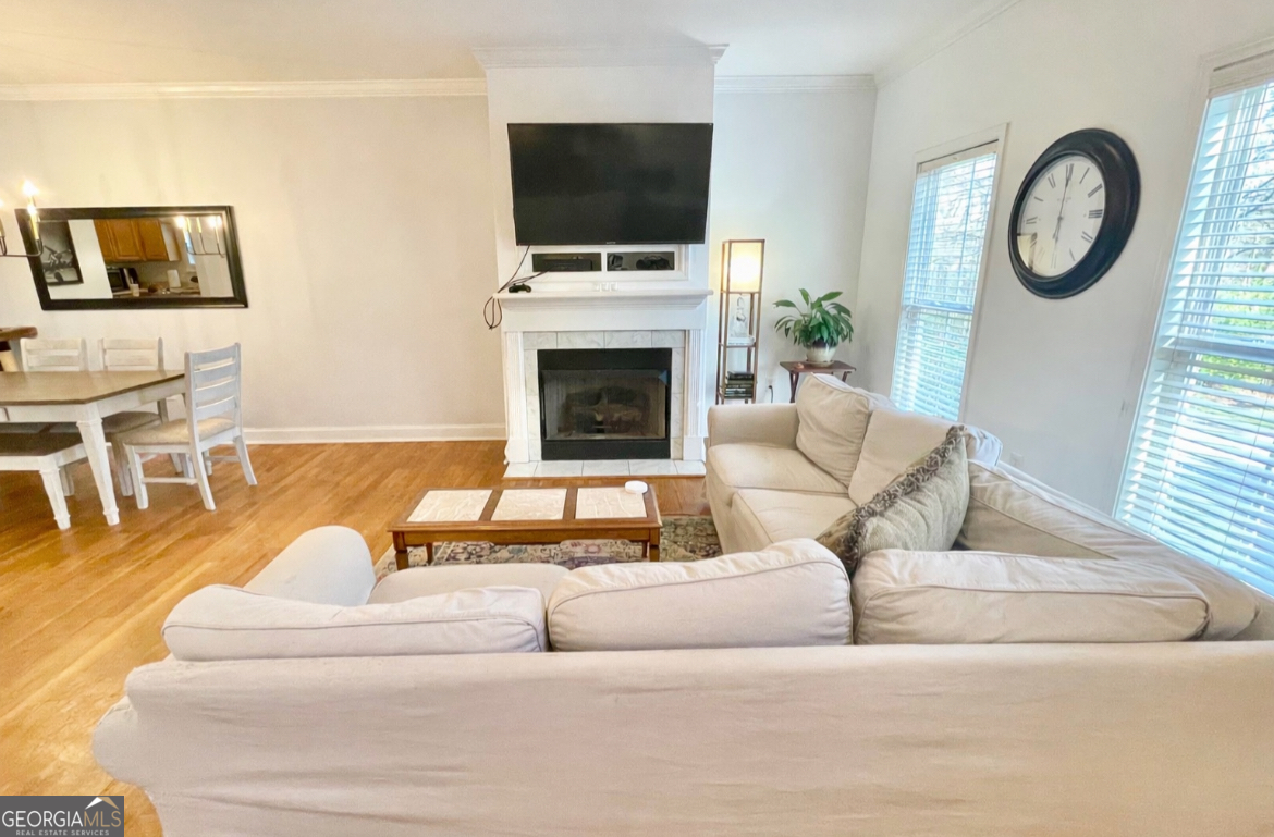 376 Providence Boulevard Macon, GA 31210 - Photo 3 of 26 a living room with furniture a flat screen tv and a fireplace
