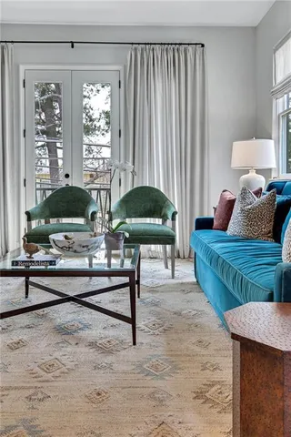 a living room with furniture and a table