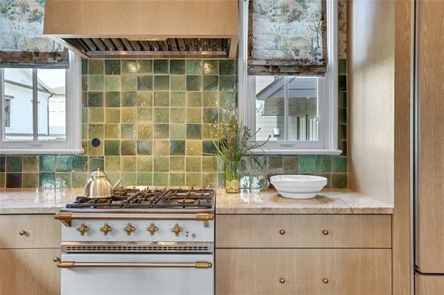 a view with granite countertop a sink and a window