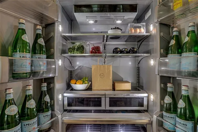 a bedroom with a bed and a mirror