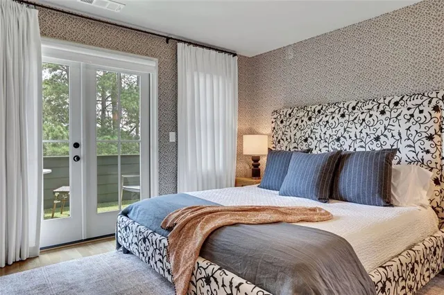 a bedroom with a bed and a mirror