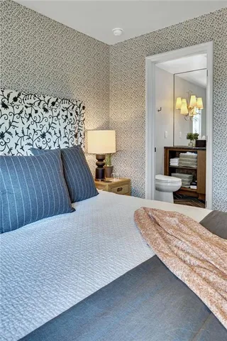 a bathroom with a sink a toilet and bathtub