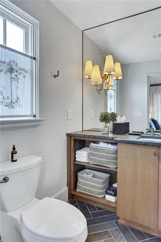 a balcony with table and chairs