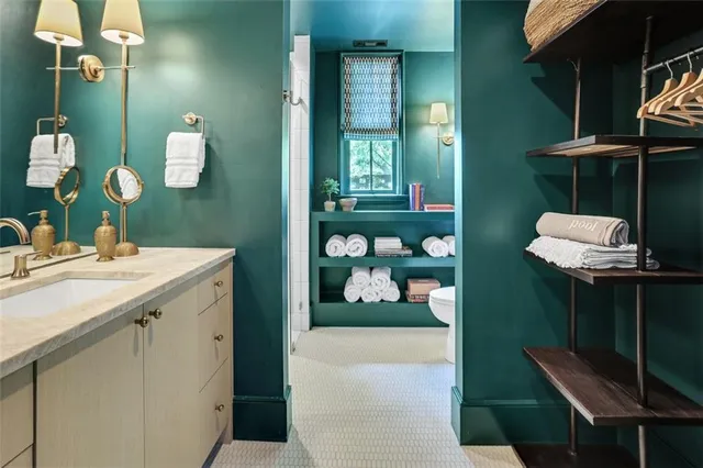 a bathroom with a double vanity sink and a mirror