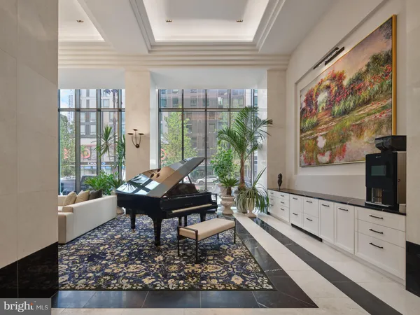 a living room with furniture a large window and a flat screen tv