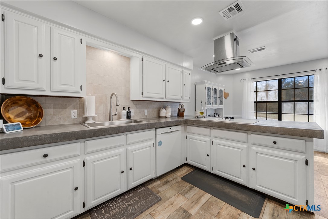 162 High Ridge Drive Bruceville, TX 76630 - Photo 12 of 35 a kitchen with granite countertop white cabinets and white appliances