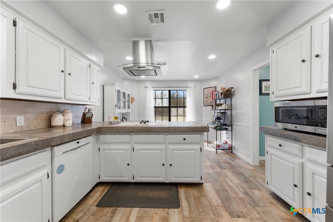 162 High Ridge Drive Bruceville, TX 76630 - Photo 13 of 35 a kitchen with stainless steel appliances granite countertop a stove sink and cabinets