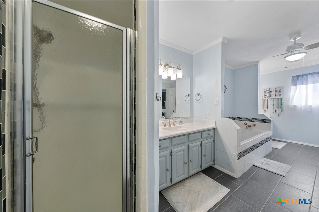 162 High Ridge Drive Bruceville, TX 76630 - Photo 16 of 35 a spacious bathroom with a shower sink and mirror