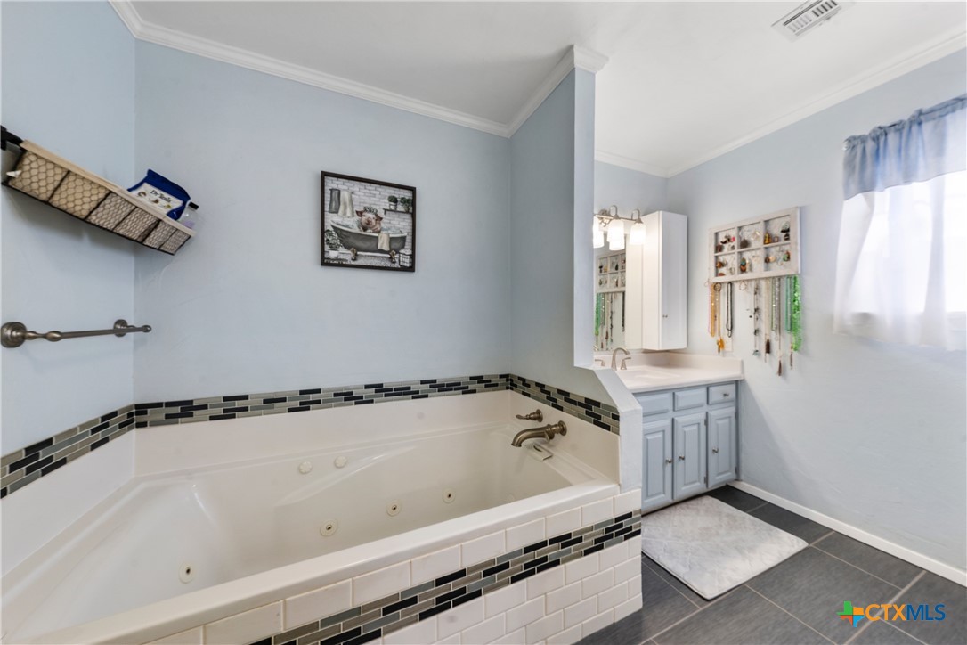 162 High Ridge Drive Bruceville, TX 76630 - Photo 18 of 35 a bathroom with a bathtub and shower