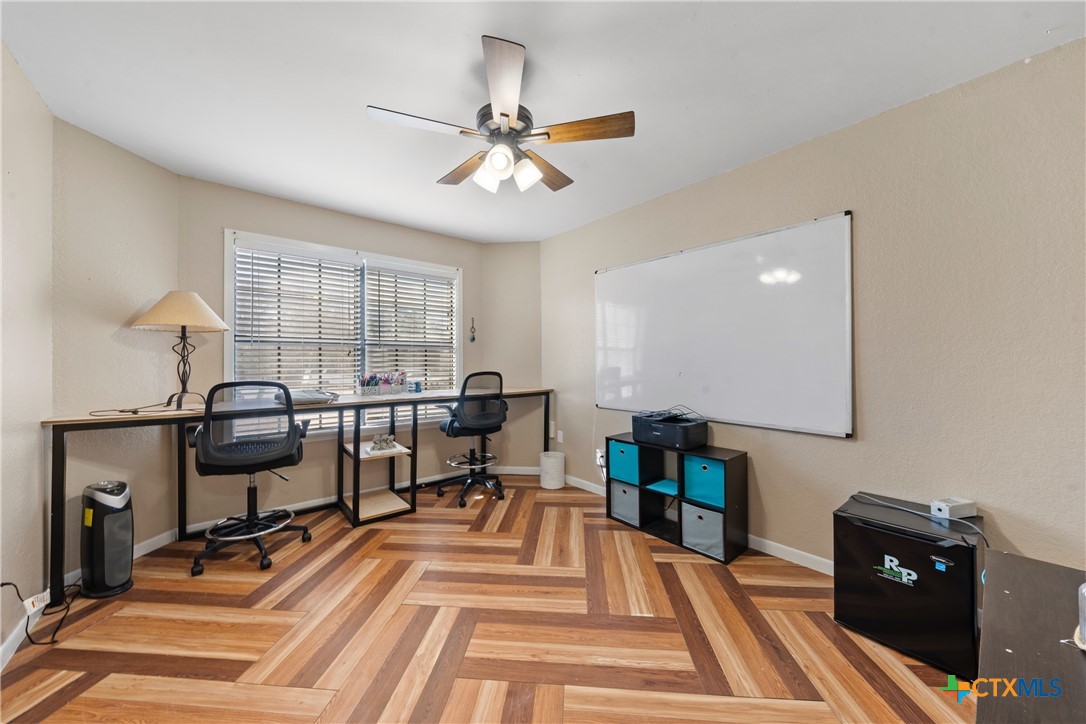 162 High Ridge Drive Bruceville, TX 76630 - Photo 22 of 35 a view of a workspace with furniture and a window