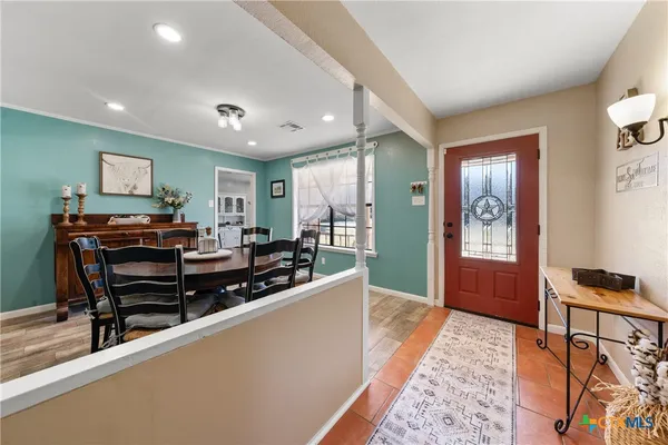 a living room with furniture and a piano