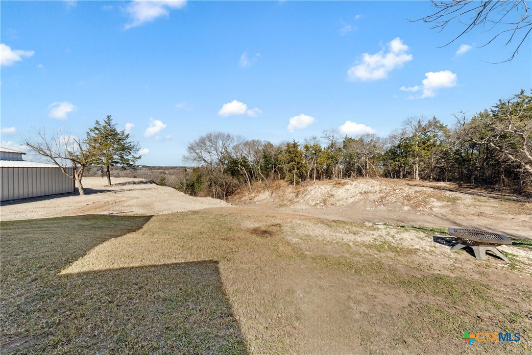 162 High Ridge Drive Bruceville, TX 76630 - Photo 31 of 35 a view of a yard covered in snow