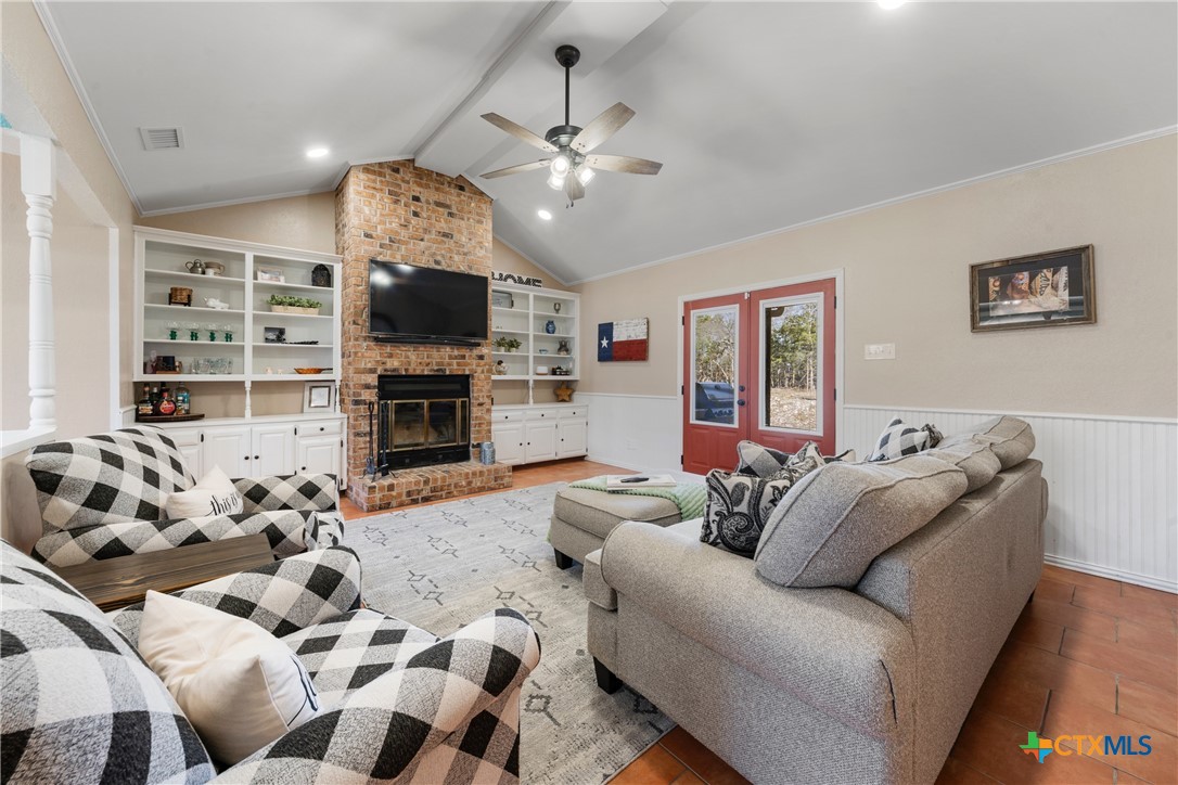 162 High Ridge Drive Bruceville, TX 76630 - Photo 5 of 35 a living room with furniture flat screen tv and a fireplace