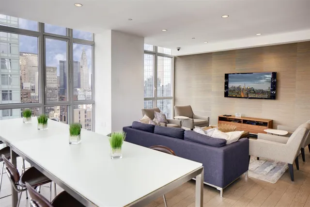 a group of people sitting in front of a building