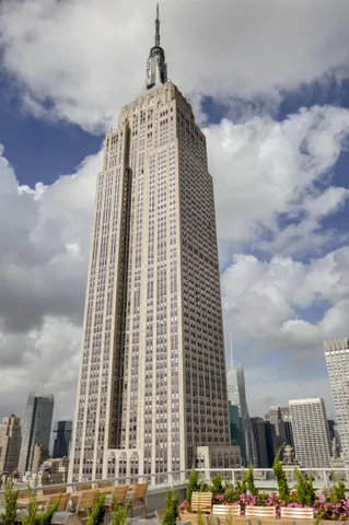 a view of a patio with couches and potted plants