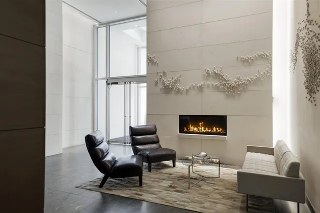 a kitchen with a refrigerator and a stove top oven