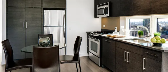 a bedroom with a bed and a night stand