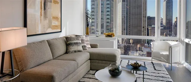 a kitchen with a stove a sink and a microwave