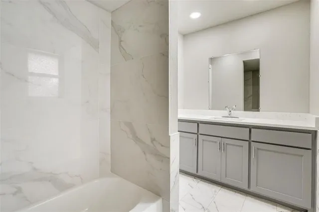 a bathroom with a bathtub and a toilet