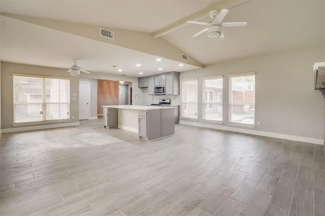a kitchen with a stove and a sink