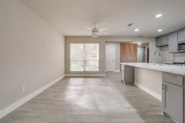 wooden floor in an empty room with a fireplace
