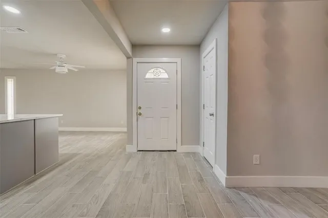 a view of a kitchen with a sink and a window
