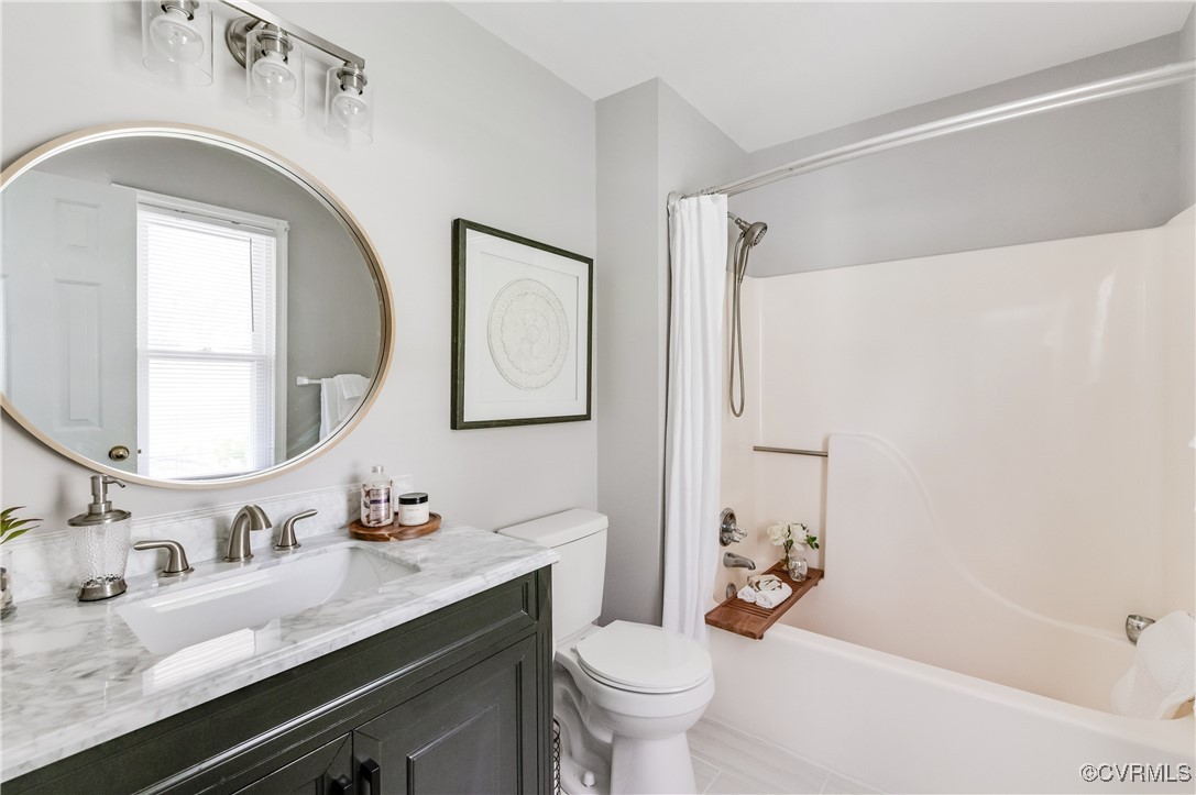 12007 Taplow Road Midlothian, VA 23112 - Photo 24 of 49 a bathroom with a granite countertop sink mirror vanity and toilet