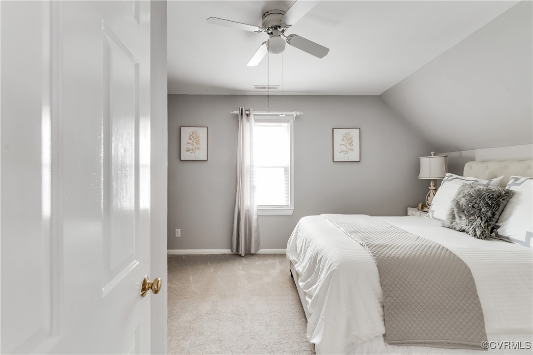 12007 Taplow Road Midlothian, VA 23112 - Photo 29 of 49 a bedroom with a bed and a chandelier