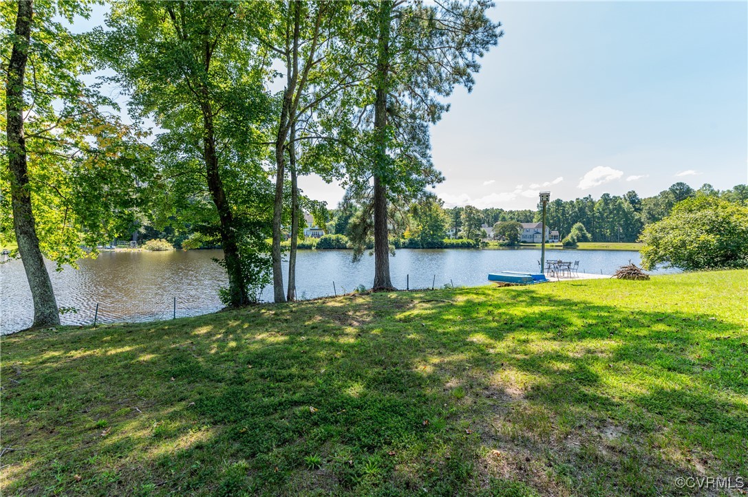 12007 Taplow Road Midlothian, VA 23112 - Photo 3 of 49 a view of a backyard with large trees