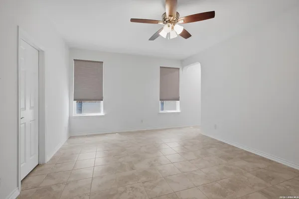 a view of an empty room with a window