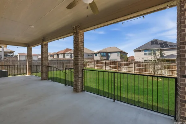 a view of a green field with a roof deck