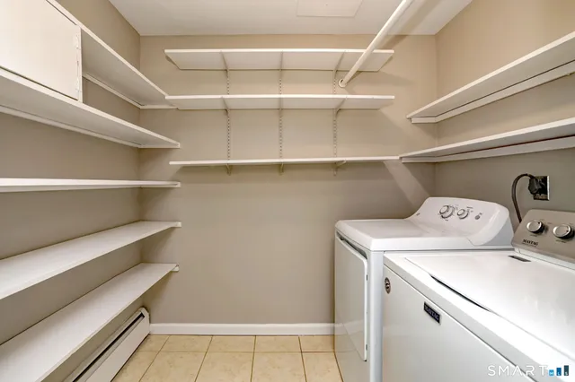 a utility room with washer and dryer