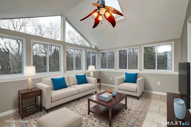 a living room with furniture and a large window